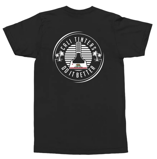 A black short-sleeve t-shirt shown from the back, featuring a large white circular graphic print on the center back with a bottle illustration, palm trees, and the text 'CALI TINTERS DO IT BETTER'.