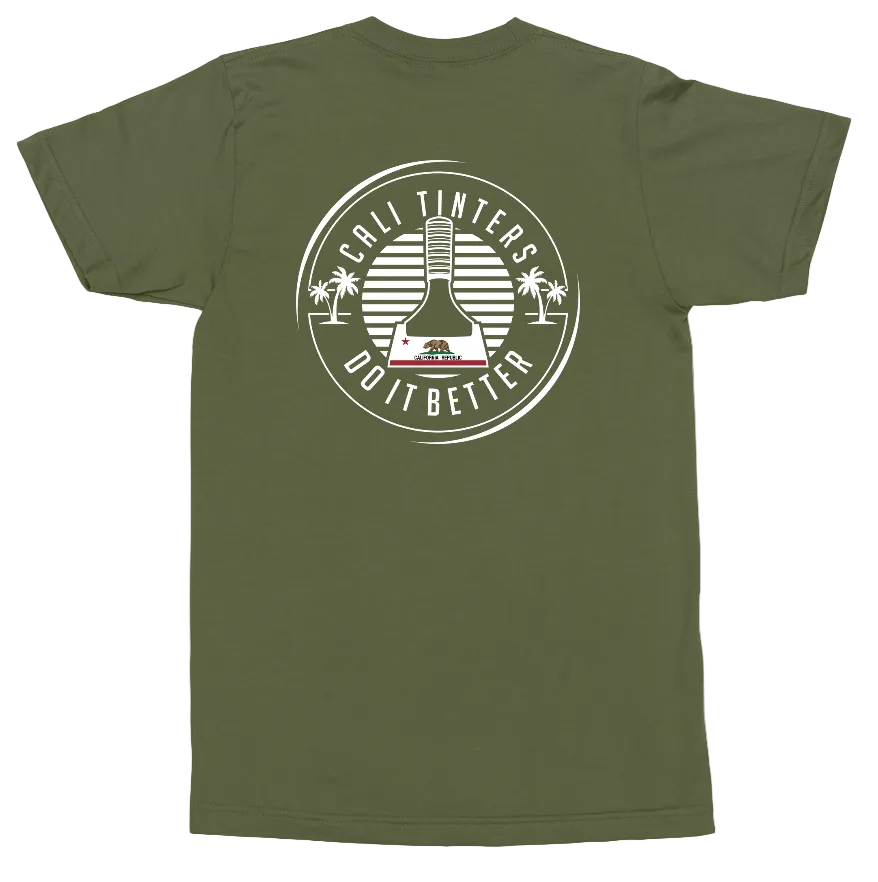 An olive green short-sleeve t-shirt shown flat against a white background, featuring a large white circular graphic on the back with a bong illustration and the text 'COLI TINTERS DO IT BETTER'.