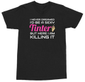A black short-sleeve crewneck t-shirt with a graphic text print on the front. The text reads 'I NEVER DREAMED I'D BE A SEXY Tinter BUT HERE I AM KILLING IT' in white and pink lettering, with a small hand holding a paintbrush graphic replacing the letter 'i' in 'Tinter'.