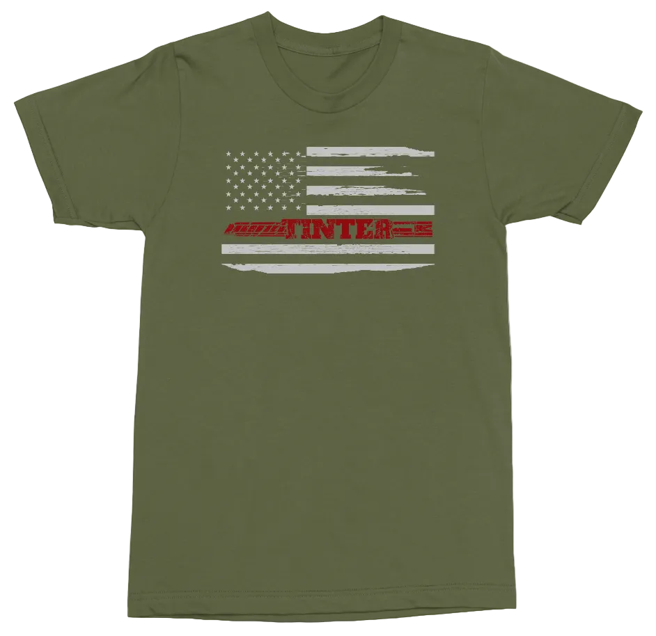 An olive green short-sleeve t-shirt with a distressed American flag graphic on the chest. The graphic features white stripes and stars, with the word 'FIGHTER' printed in red across the center stripe.