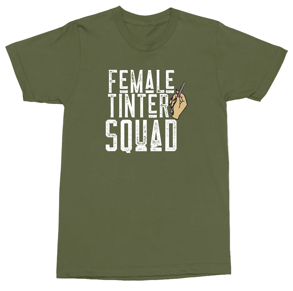 An olive green short-sleeve t-shirt with a distressed white graphic reading 'FEMALE TINTER SQUAD' and a small hand holding a light bulb, shown on a plain white background.