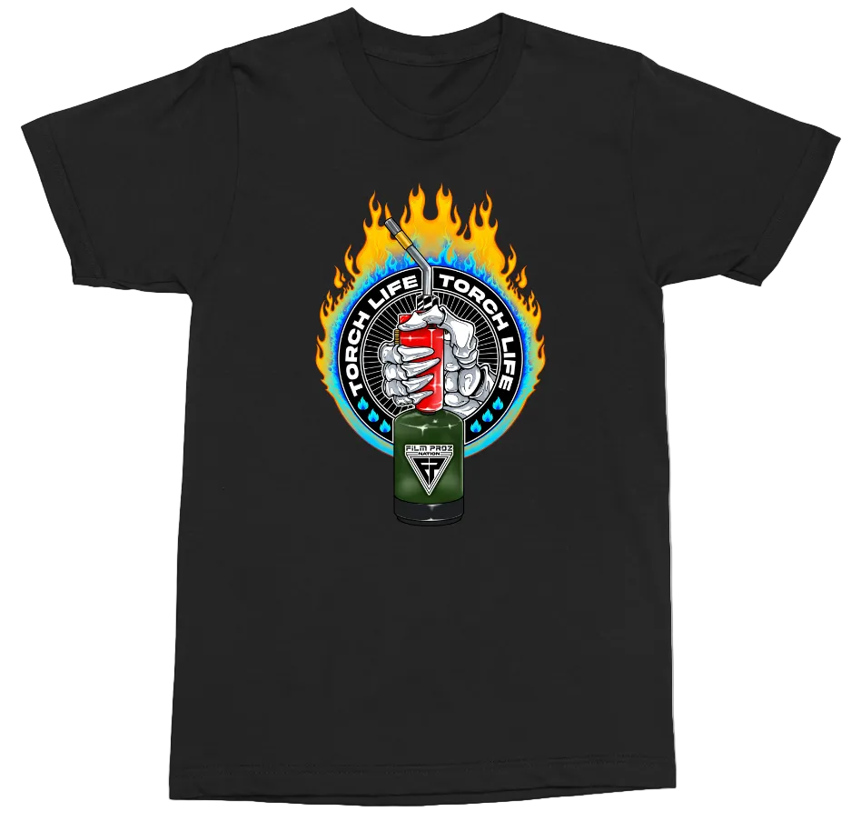 A black short-sleeve crewneck t-shirt featuring a circular graphic on the chest. The graphic shows a green and red energy drink can with a lit match, surrounded by blue flames and the words 'TORCHLIFE TORCH IIFE', with a skull and crossbones motif in the center.