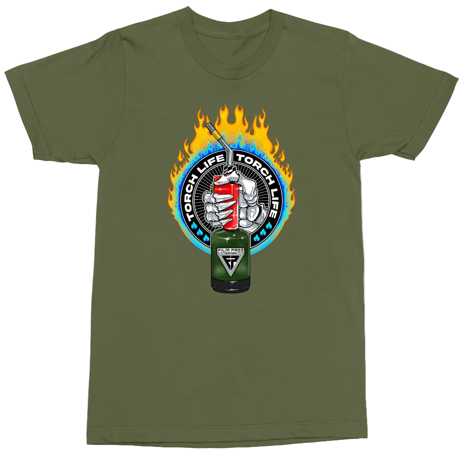 An olive green short-sleeve t-shirt with a circular graphic on the chest featuring a flame, a red-and-white striped lighter, and a green can labeled 'TORCH LIFE TORCH LIFE'.