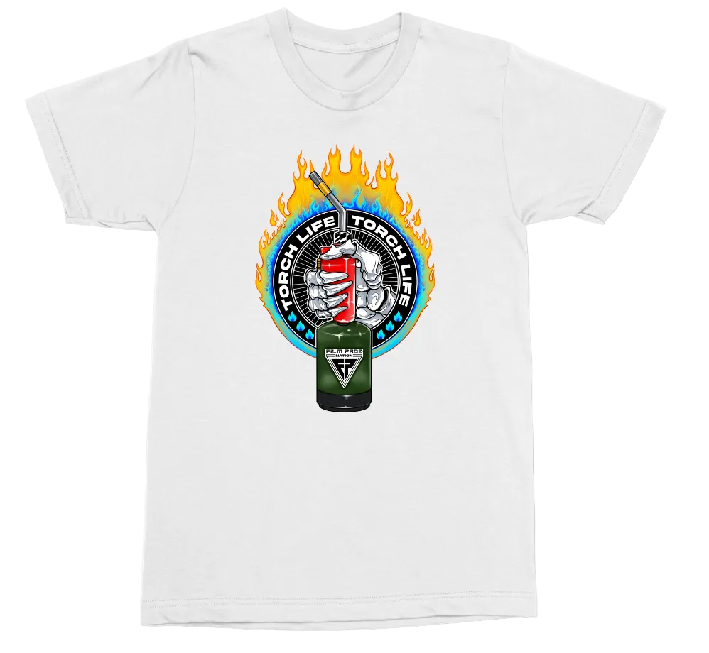 A white short-sleeve crewneck t-shirt featuring a circular graphic on the chest with flames, a fist holding a red cup, and a green energy drink can labeled 'Torch Life Torch War' with a triangular logo.