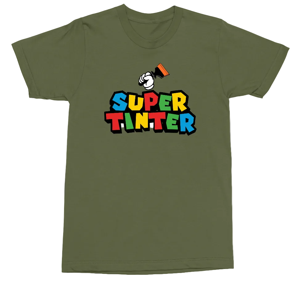 An olive green short-sleeve t-shirt with a colorful graphic on the chest. The graphic features a cartoon hand holding a paintbrush above the text 'SUPER TINTER' in bold, multi-colored block letters (blue, yellow, red, green, orange, black).