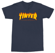 Load image into Gallery viewer, A navy blue short-sleeve t-shirt with a prominent orange and yellow flame-style graphic on the chest reading 'TINTER' and smaller text 'LIFESTYLE' underneath, displayed on a clean white background.
