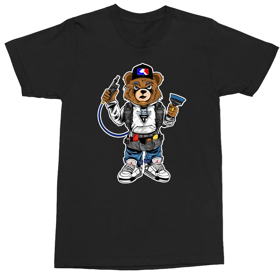 A black short-sleeve crewneck t-shirt featuring a cartoon graphic of a bear character dressed in a white and blue racing suit, holding a gun and a flag, set against a plain white background.
