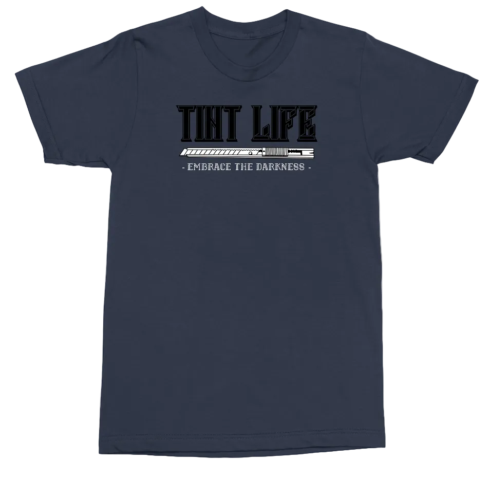 A navy blue short-sleeve t-shirt with a black and white graphic on the chest reading 'THAT LIFE' and '- EMBRACE THE DARKNESS -' on a plain white background.